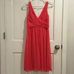 David’s Bridal bridesmaids dress in bright salmon.